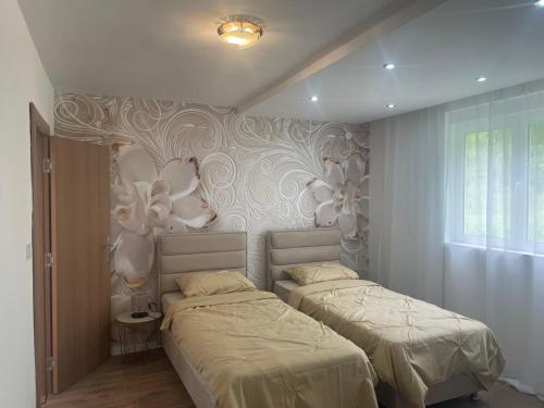 Postel nebo postele na pokoji v ubytování Villa Albatros