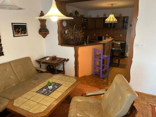a living room with a couch and a table at Hondo Rooms & Apartments in Sarajevo