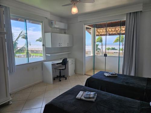 TV a/nebo společenská místnost v ubytování Mansão Frente Mar