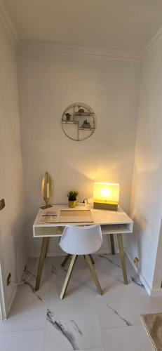 a desk with a laptop computer on top of it at Let's RelaxX Luxury class in Mülheim an der Ruhr