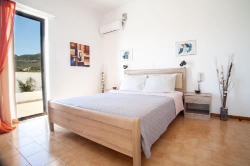 Ένα ή περισσότερα κρεβάτια σε δωμάτιο στο Hotel Porto Diakofti