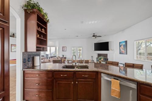 a kitchen with a sink and a counter top at Lucky Getaway LV in Las Vegas