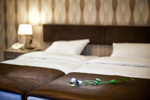 Łóżko lub łóżka w pokoju w obiekcie Świętokrzyska Polana - Medical Resort