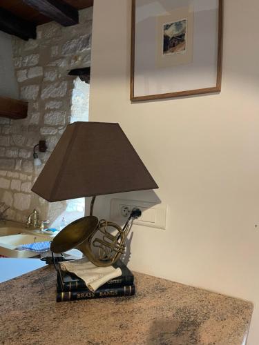 a chair with a lamp on a table at La Maison d'Alienor Les Valmurs in Chablis
