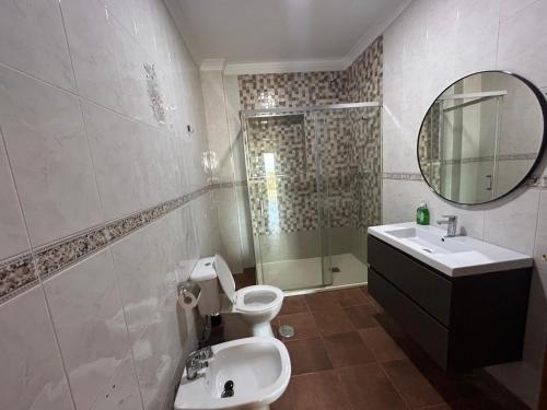 a bathroom with a toilet and a sink and a shower at Casa Rural Alora Caminito del Rey in Alora