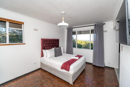 Postel nebo postele na pokoji v ubytování Grandview lodge
