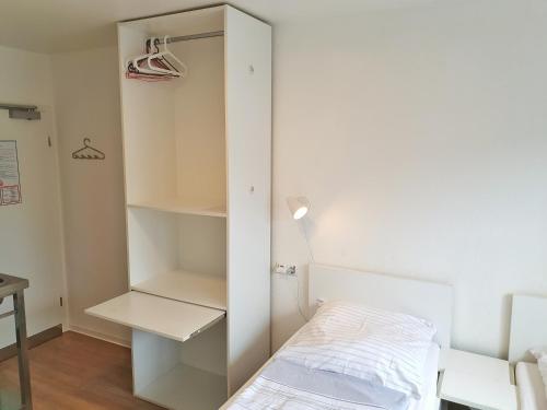Ένα ή περισσότερα κρεβάτια σε δωμάτιο στο Aparthotel Jonas
