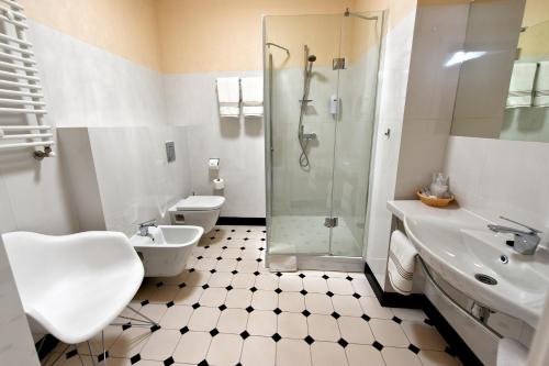 a bathroom with a shower and a toilet and a sink at Świętokrzyska Polana - Medical Resort in Chrusty