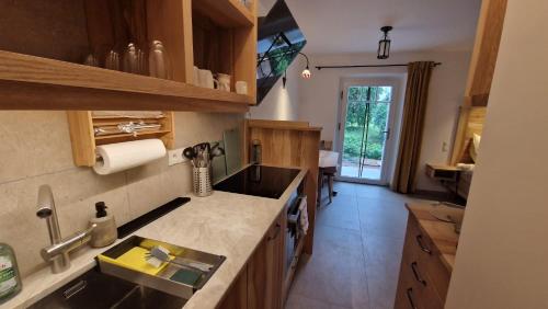 a kitchen with a sink and a counter top at Ferienwohnung BERGWELTEN in Oberaudorf