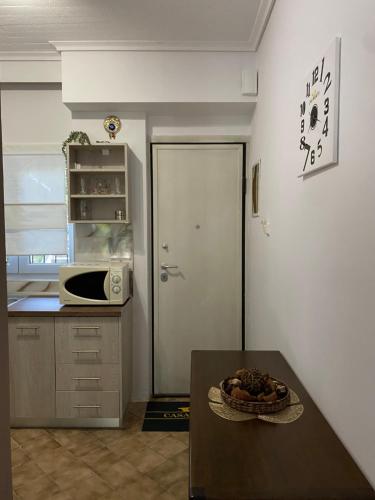 a kitchen with a table with a bowl of food on it at Casa Venti Perea in Perea