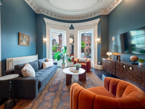 a living room with a couch and a table at The Chester Hotel in Boston