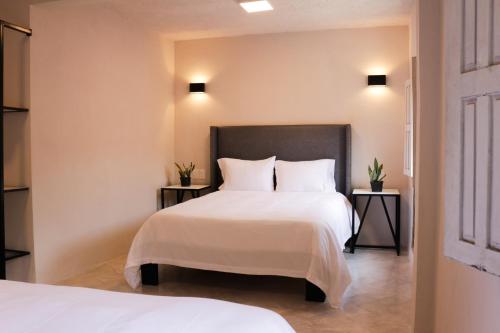 Ένα ή περισσότερα κρεβάτια σε δωμάτιο στο Casa Doper Relox