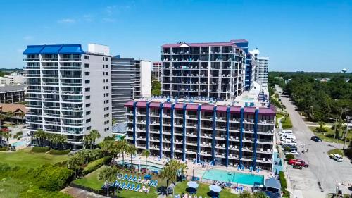 an aerial view of two tall buildings and a pool at Grande Shores Ocean Resorts Condominiums in Myrtle Beach
