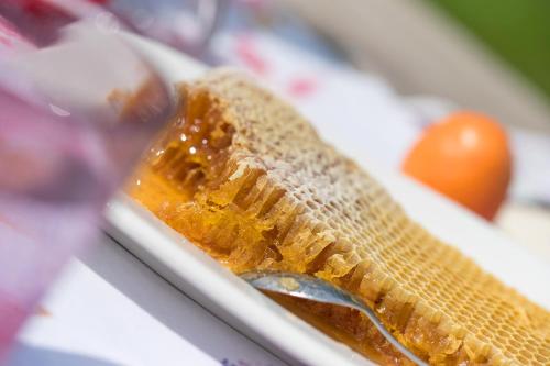 a close up of a banana on a plate with a spoon at Ferienwohnungen Theresienhof in Ledenitzen