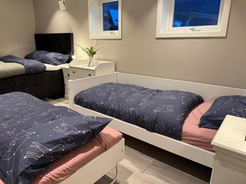 Postel nebo postele na pokoji v ubytování StarView Trolltunga Apartment