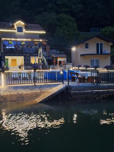 a house next to a body of water at night at Vila Gavrić in Zvornik