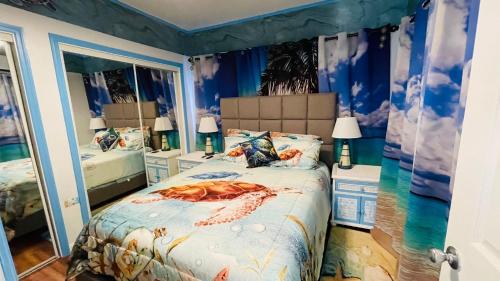 a bedroom with a bed with a crab on it at Blue Paradise in Prospect Park