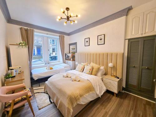 a bedroom with a bed with a dog on it at River Haven Edinburgh in Edinburgh