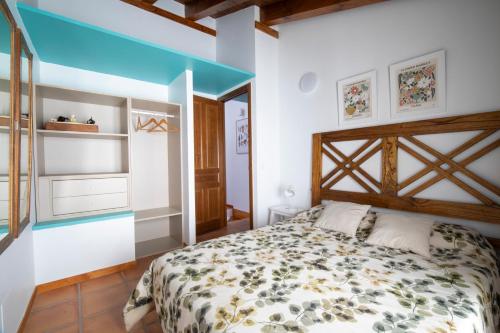 a bedroom with a bed in a room at Casa Rural La Rosalia in Cogolludo