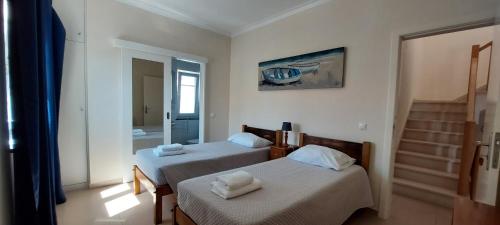 En eller flere senge i et værelse på Casa Penedo do Forno