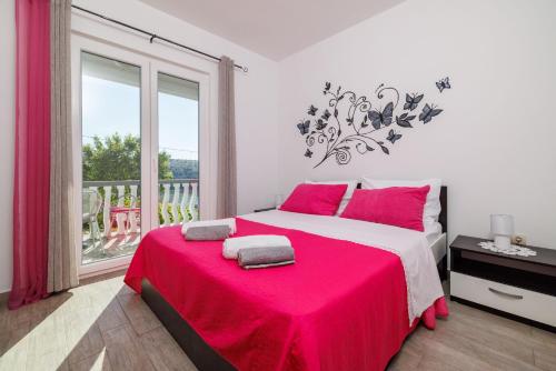 Postel nebo postele na pokoji v ubytování Apartments Klara