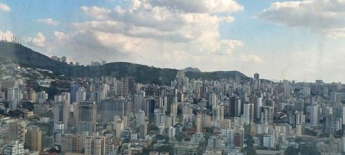 an aerial view of a large city with buildings at Suíte Alto Afonso Pena in Belo Horizonte