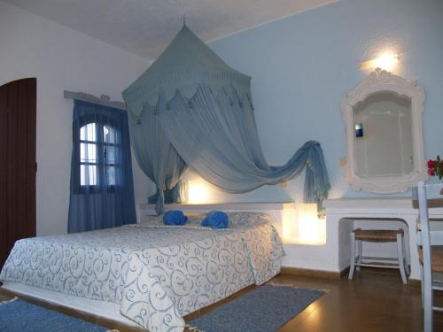 Postel nebo postele na pokoji v ubytování Cretan Village Hotel