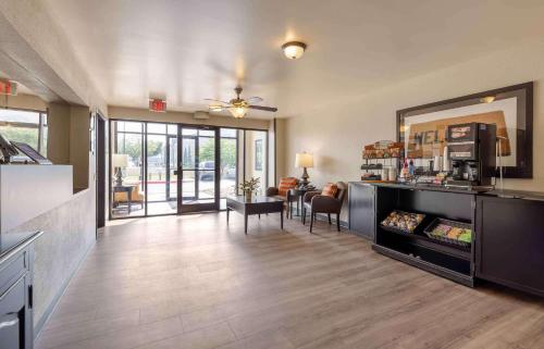 a living room with a kitchen and a dining room at Extended Stay America Suites - Wichita - East in Wichita