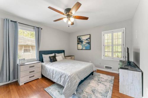 a bedroom with a bed and a ceiling fan at Picture-Perfect Charmer in North Decatur in Decatur