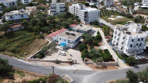 an aerial view of a city with houses and a street at Vila Kylie in Ksamil