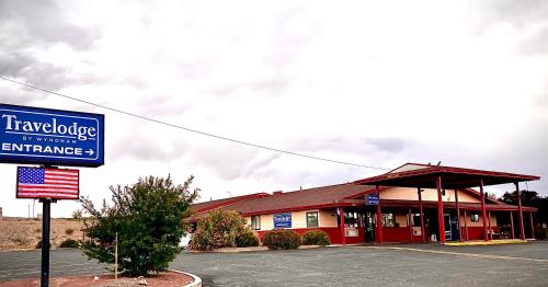 a building with a sign in front of it at Travelodge by Wyndham Truth or Consequences in Truth or Consequences