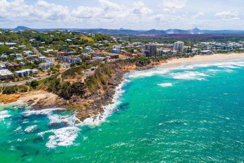 an aerial view of a beach and the ocean at Beach Life at Coolum in Coolum Beach
