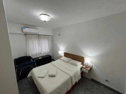 Ένα ή περισσότερα κρεβάτια σε δωμάτιο στο Departamento amplio y luminoso