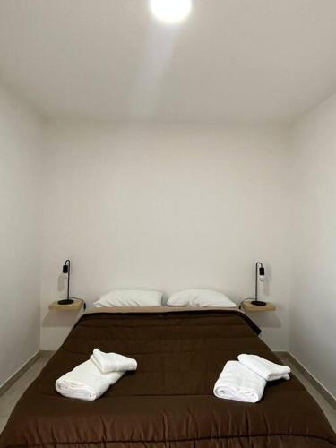 Ένα ή περισσότερα κρεβάτια σε δωμάτιο στο Departamento céntrico en Neuquén