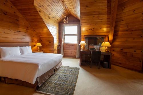 Postel nebo postele na pokoji v ubytování The Richforest Hotel- Sun Moon Lake