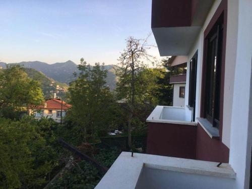 a balcony of a house with a view of the mountains at Atlas6161 in Trabzon