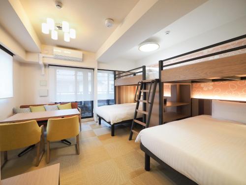 Postel nebo postele na pokoji v ubytování HIYORI Stay Kyoto Kamogawa