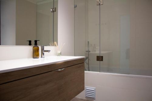 a bathroom with a sink and a shower at Villa Verde Priv Pool, 10min beach, near Lisbon in Amora