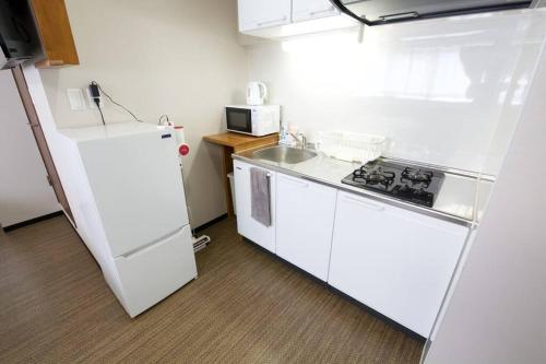 Η κουζίνα ή μικρή κουζίνα στο Tommy Condominium WAKASA 302