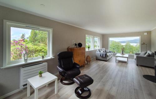 a living room with a couch and a table and chairs at Amazing Home In Vikebygd With Wifi in Vikebygd