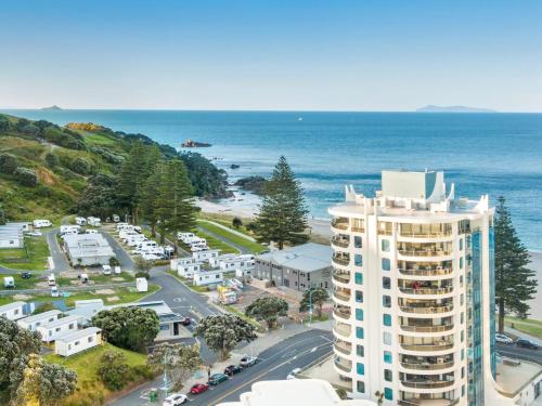an aerial view of a building and the ocean at Oceanstyle on Main in Mount Maunganui