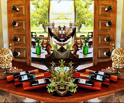 a table with a bunch of bottles of wine at Pousada Marajoara- Hotel Fazenda-Turismo de Aventura in Soure