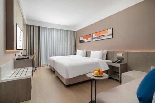 Cama o camas de una habitación en Hyatt Place Linyi People Square