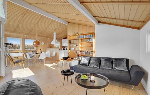 a living room with a couch and a table at 4 Bedroom Beautiful Home In Slagelse in Slagelse