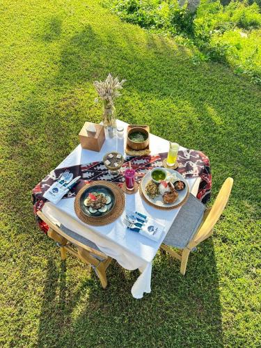 an overhead view of a table with plates of food at Morika Villa in Rua