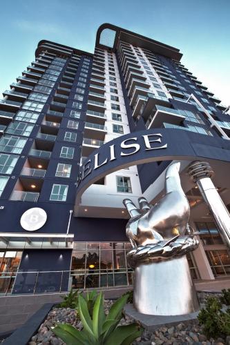a building with a statue in front of it at Belise Apartments in Brisbane