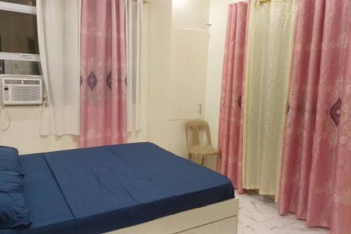 Postel nebo postele na pokoji v ubytování Guiuan Bayview