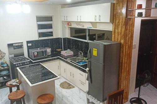 Kuchyň nebo kuchyňský kout v ubytování Guiuan Bayview