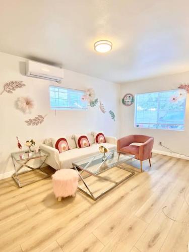 a living room with a couch and a table at Pink Cozy house 2 bedrooms in Rosemead
