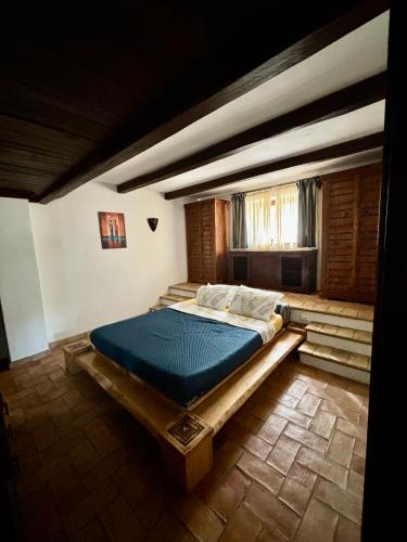a bedroom with a large bed in a room at Locanda delle sorelle in Campagnano di Roma